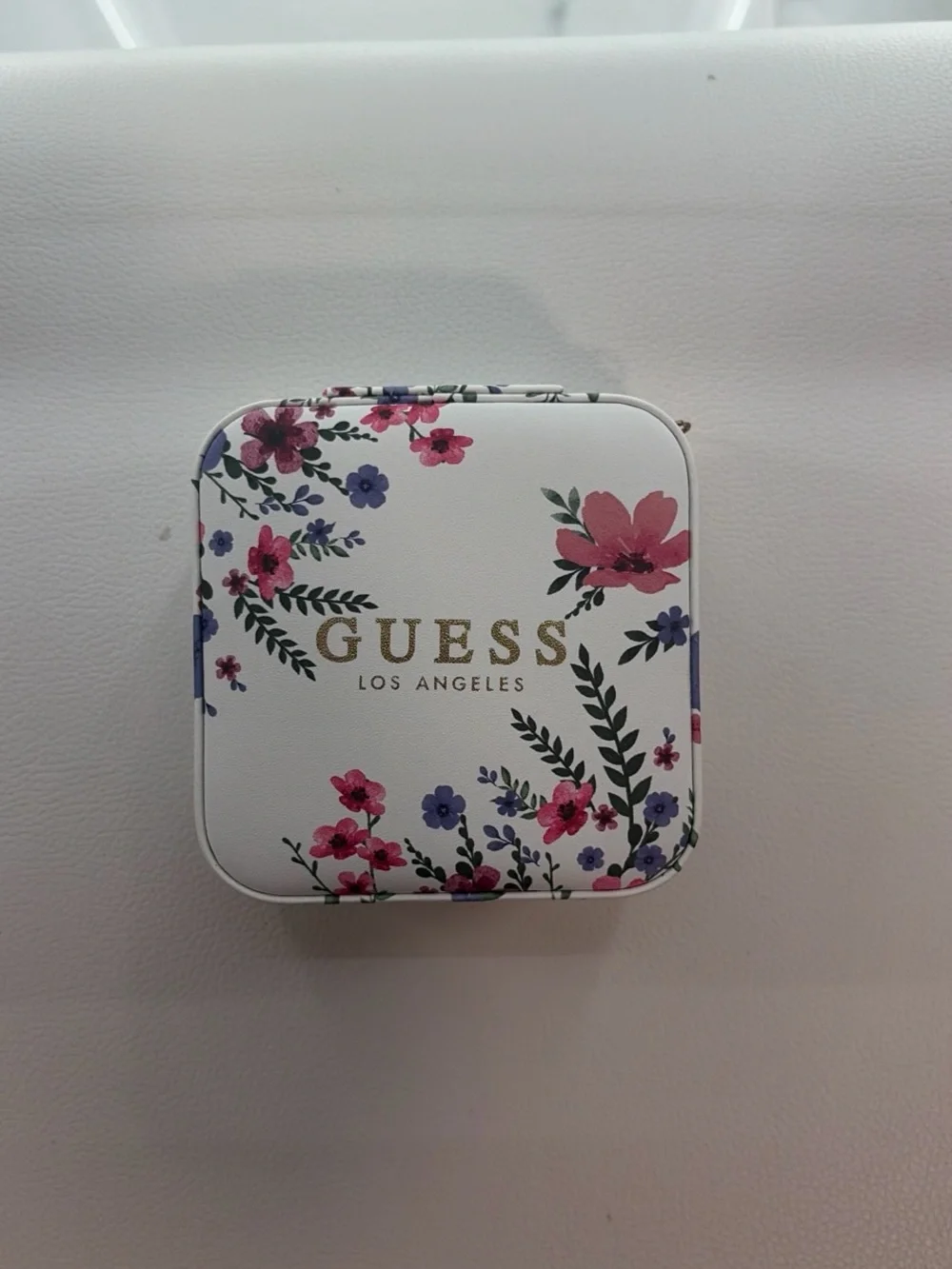 GUESS White Floral Cosmetic Case with Gold Logo